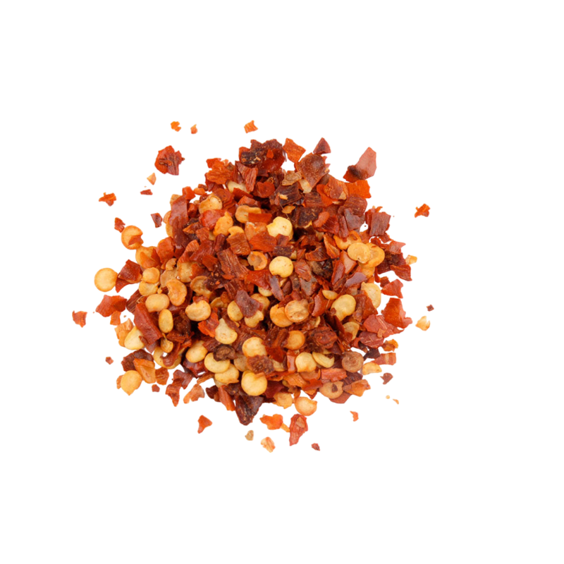 close up of red paper flakes bright red