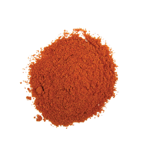 a pile of bright red cayenne pepper grounded for cooking