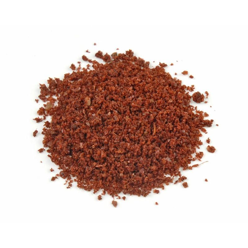 A pile of grounded berries has a dark red color